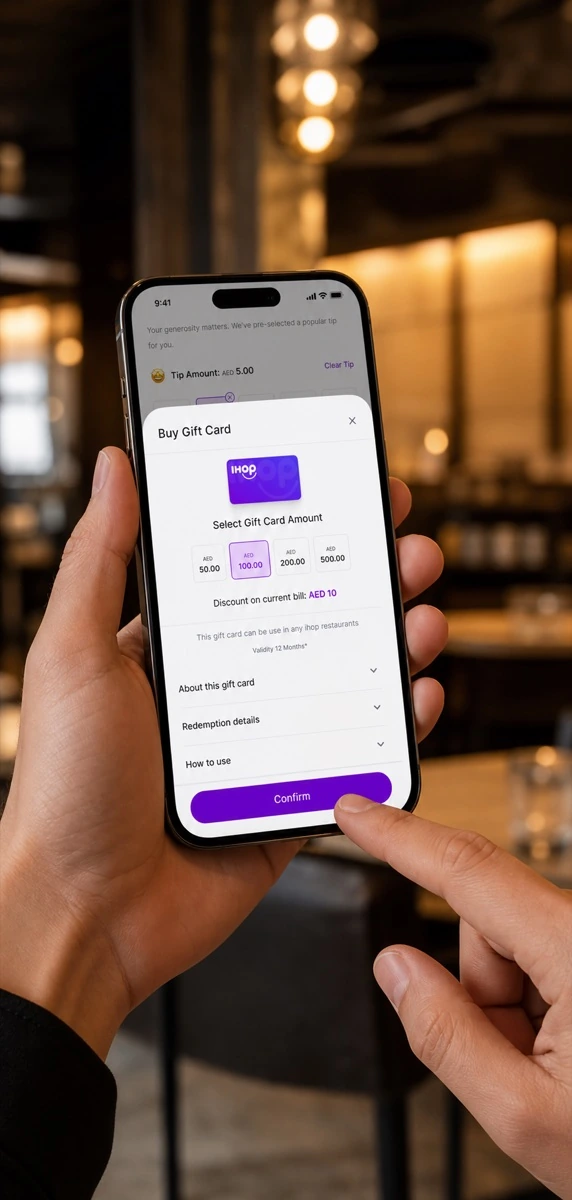 A diner buying a qlub gift card on a phone